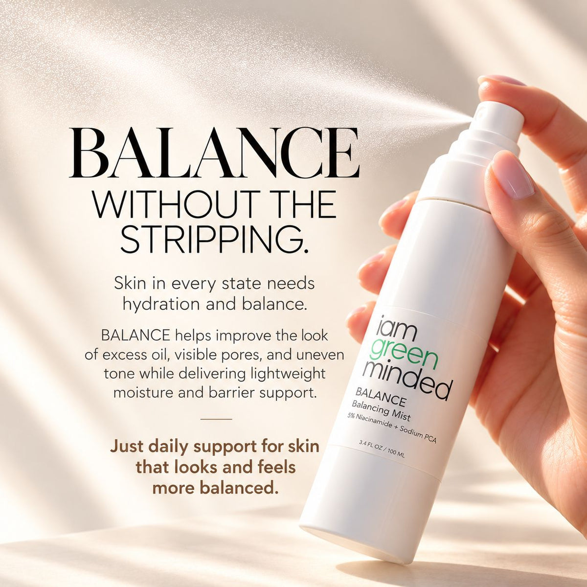 A hand holds a white pump bottle labeled 'iam green minded BALANCE Balancing Mist' against a warm, sunlit cream background with promotional text about skin hydration and balance.
