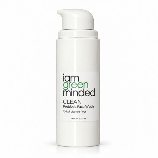 A white cylindrical pump bottle of iam green minded Clean Prebiotic Face Wash on a white background.