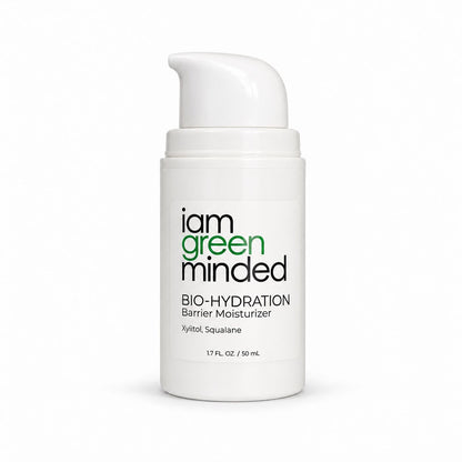 A white pump bottle of iam green minded Bio-Hydration Barrier Moisturizer with black and green text on the front label, set against a clean white background.